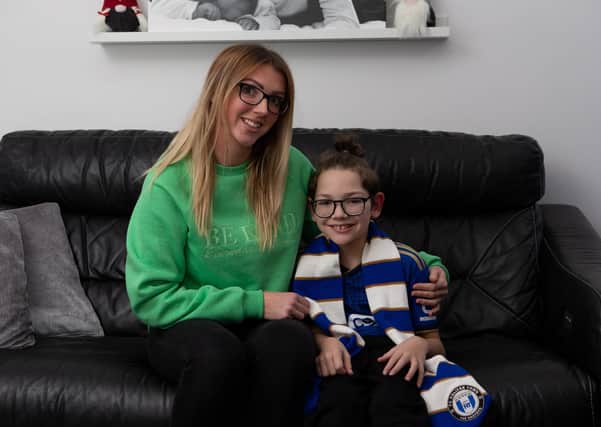 Young Halifax Town fan Charlie Potts, with his Mum, Lucy Littley, have been raising money for a new wheelchair