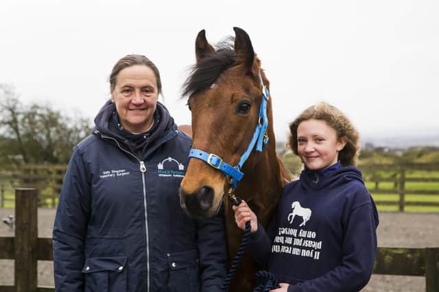 Minstrel the pony with vet Sally Strachan, and owner Gracie Greenwood, 11, at Hird and Partners horse hospital, Shelf.