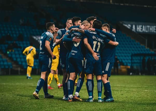 FC Halifax Town players celebrate a goal against Altrincham on Monday. Photo: Marcus Branston