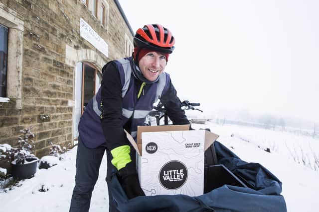Cargodale delivery rider Stuart Hyde loads up at the Great Rock Co-op, Todmorden.