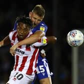 BRISTOL, ENGLAND - AUGUST 13:  Alfie Kilgour of Bristol Rovers challenges Tahvon Campbell of Cheltenham Town during the Carabao Cup First Round match between Bristol Rovers and Cheltenham Town at Memorial Stadium on August 13, 2019 in Bristol, England. (Photo by Michael Steele/Getty Images)