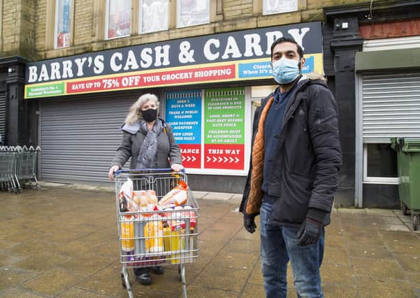 Barry's Cash & Carry website Cut Price Barry's crashed after social media influencer did unboxing video of food ordered from the site. Abrar Khaliq, right, with customer Glenda Bairstow.