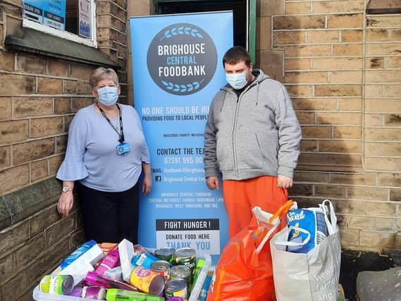 George Davidson with the donation to foodbank.