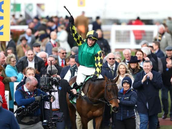 Adam Wedge celebrates his success at the 2020 Cheltenham Festival with Lisnagar Oscar, which is part-owned by former Scarborough FC winger Tony Outhart.