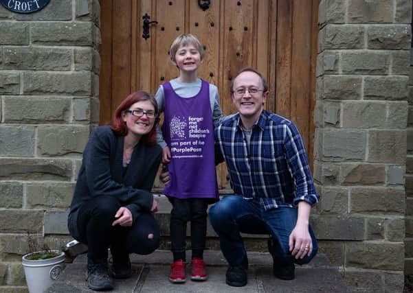 Gabriella and Carl Walker and their son Calvin in Hebden Bridge - Calvin has been doing a running challenge to raise money for Forget Me Not