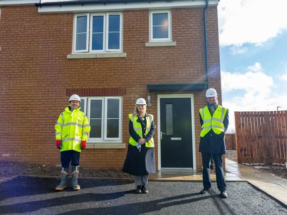 Andrew Gill, Contracts Manager, Lovell Partnerships, Tracy Brabin MP, Labour candidate for West Yorkshire mayor, Dave Procter, Chair of the Together Housing Group Board outside Plot 1, Abbey Park, Illingworth, Halifax