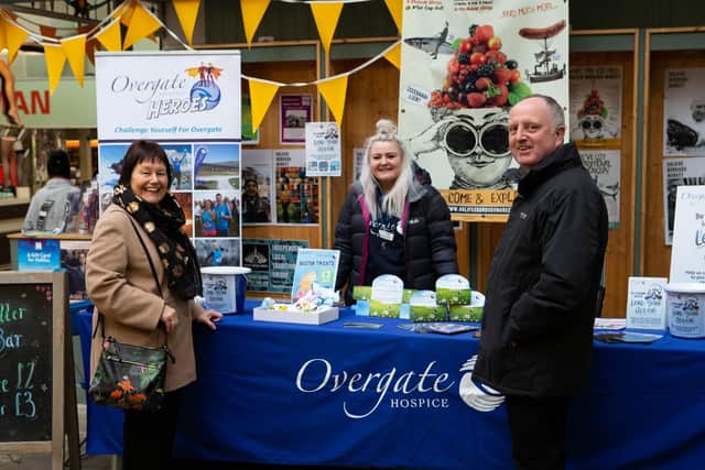 Becki Marren, visited by her parents Philip and Rosina Marren, at Overgate Hospice Leap Year final fundraisers, at the Halifax Borough Market. Photo by Bruce Fitzgerald.