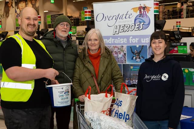 Jim Bridge and Claire Sullivan, with customers Roger and Christine Cocker, at Halifax Asda, for Overgate Hospice Leap Year final fundraisers. Photo by Bruce Fitzgerald.