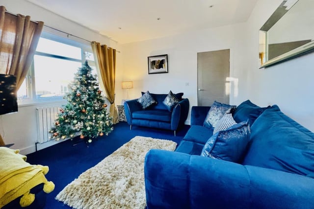 A separate sitting room at the front of the house follows the blue colour scheme on the ground floor