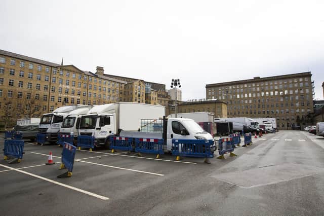 Film crew vehicles parked up outside Dean Clough in Halifax