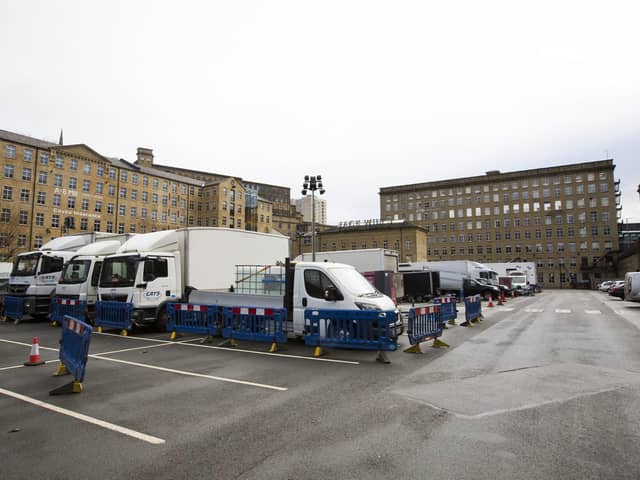 Film crew vehicles parked up outside Dean Clough in Halifax