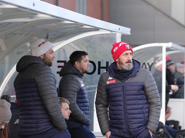 Boss Jono Greening and his Boro coaches Ryan Blott and Jimmy Beadle in the dug-out v Grantham Town