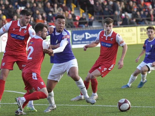 Ryan Watson, no 2, gets to grips with a Grantham rival