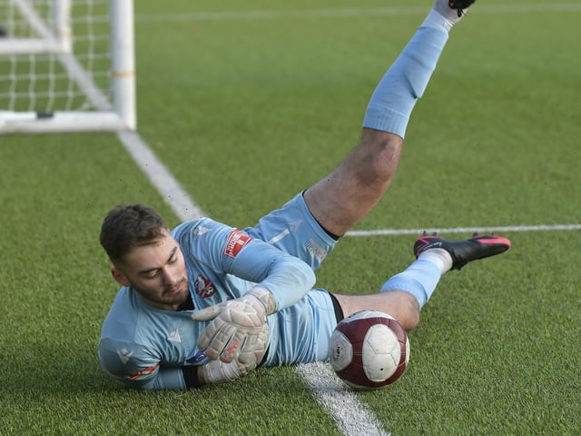 Ryan Whitley tries to keep the ball in