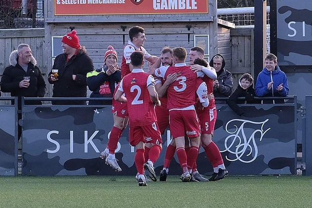 Boro players rush to celebrate the opening goal with scorer Jake Day
