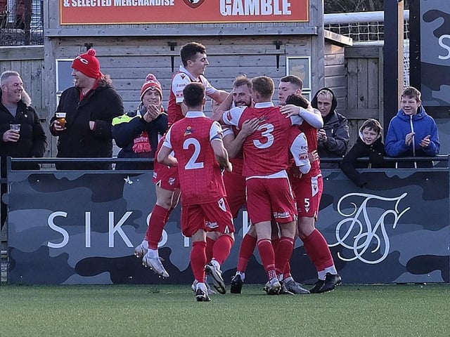 Boro players rush to celebrate the opening goal with scorer Jake Day