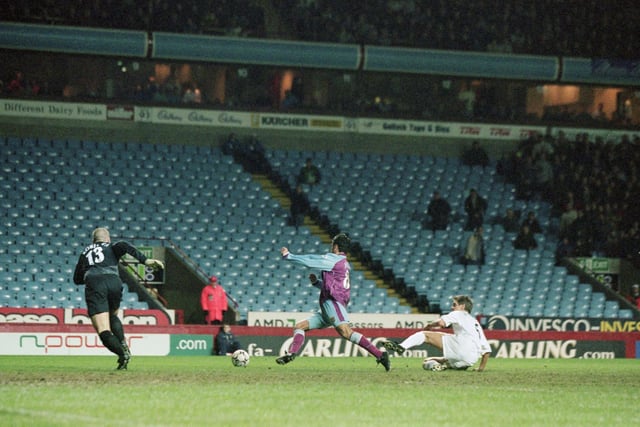 Aston Villa's Juan Pablo Angel causes havoc in the penalty area.