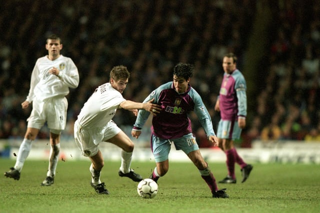 Jonny Woodgate hunts down  Aston Villa's Juan Pablo Angel.