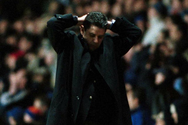 Aston Villa manager John Gregory puts his hands on his head in despair after watching his team edged out.