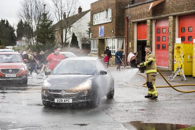 Car wash fundraiser for Ash Green Community Primary School at Illingworth Fire Station. Andy Ball, left, and Harry Stansfield.