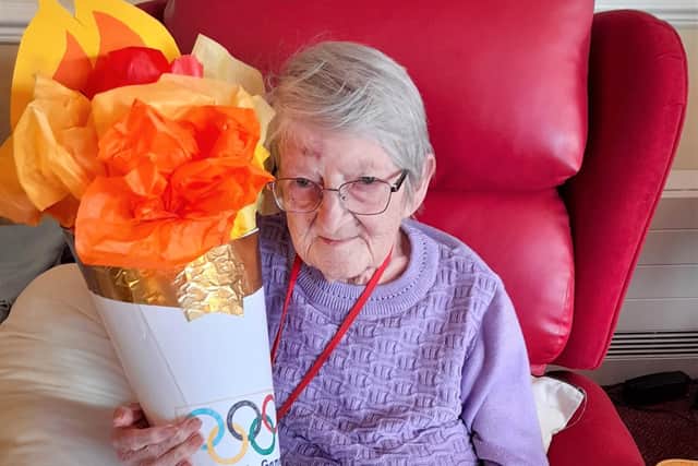 Resident Margaret Allen with the residents' Olympic torch