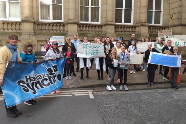 Young synchronised swimming club swimmers protesting about the concerns outside Halifax Town Hall last autumn