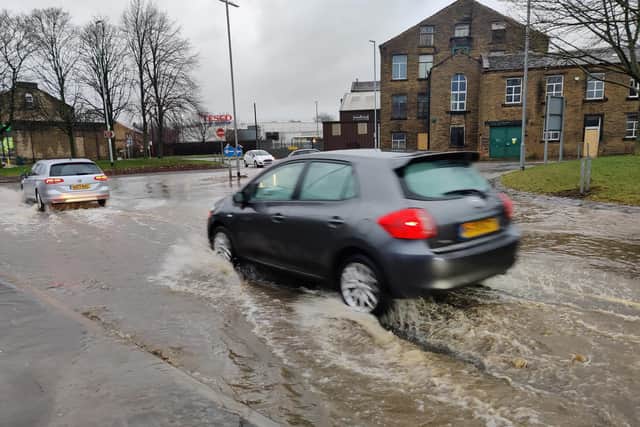 Clifton Common in Brighouse near Lidl, where the volume of rain overwhelmed the drains and flooded the roundabout. (Picture Steven Lord)