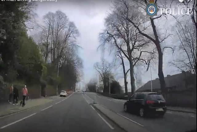 The footage shows the motorist driving on the wrong side of the road