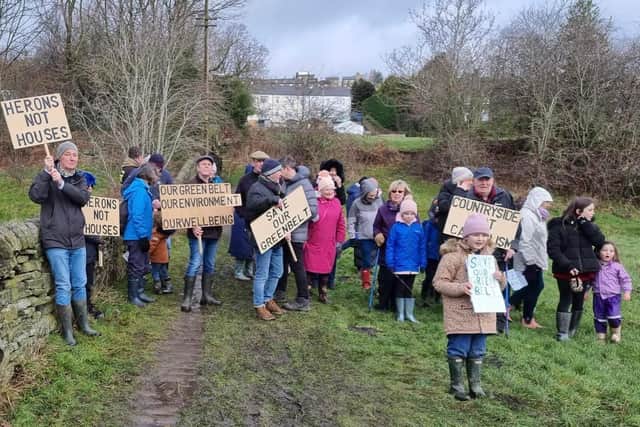 Campaigners at Greetland protest against proposals in the draft Local Plan after last weekend’s flooding