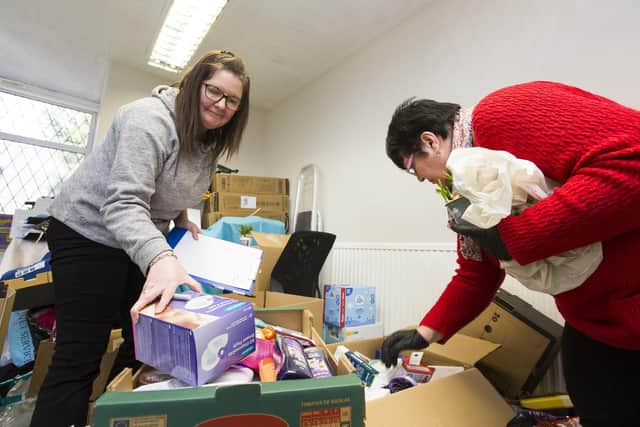 Volunteers help sort donations for the Halifax Ukrainian Club and Leo Group aid collection for people fleeing Russian invasion of Ukraine