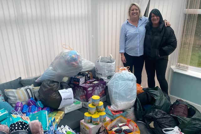 Joanne O'Donnell and Becky Reid from Norland View in Sowerby Bridge with the donations collected.