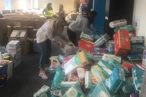 More volunteers are needed to help sort and pack donations at Dean Clough in Halifax