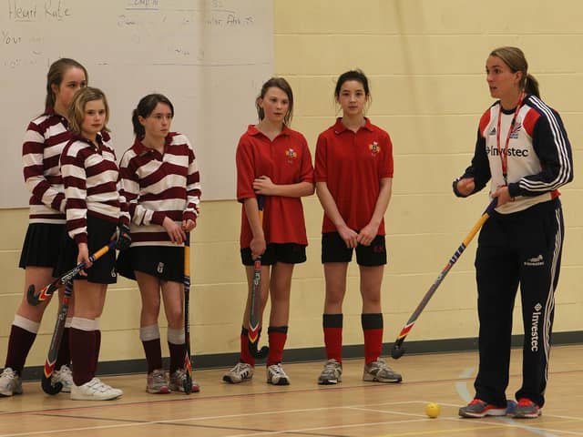 Ryburn Valley High School hosted hockey coaching sessions overseen by Great Britain's Olympics stars. Bronze medalist at the London 2012 Olympics, Laura Bartlett, is pictured with girls from Rishworth and North Halifax Grammar teams.