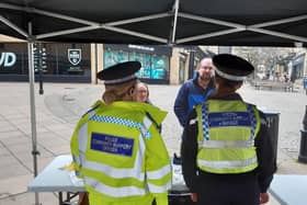 PCSOs speak to shoppers in The Woolshops in Halifax today.