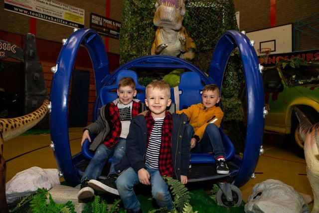 Harry Dennison, with Arthur and George Haywood, on the Jurassic Park 'ride' at Hali-Con 2019