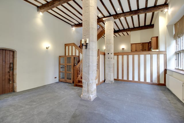 Wood and stone is prevalent within the property's spacious rooms.