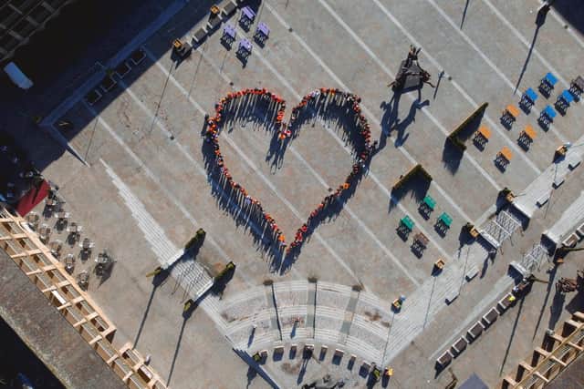 The orange heart formed in Halifax to show support for refugees