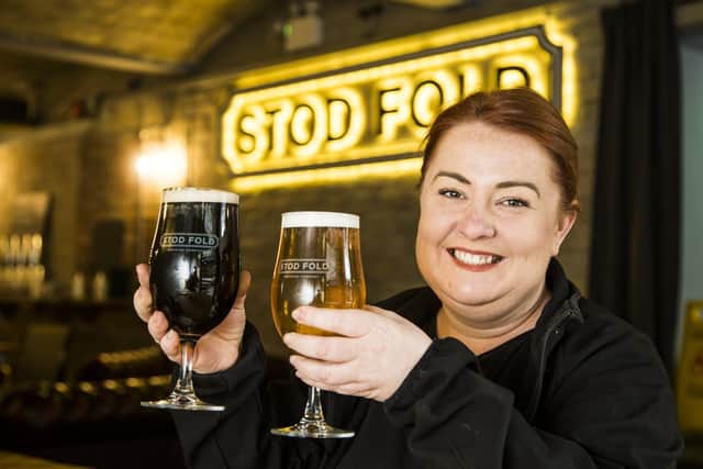 Bar manager Laura Kane at the Stod Fold bar, Dean Clough, in Halifax with beers named after Anne Lister (dark) and Ann Walker (blonde).