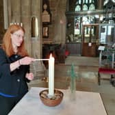 MP Holly Lynch lights a candle of hope for Ukraine at Halifax Minster