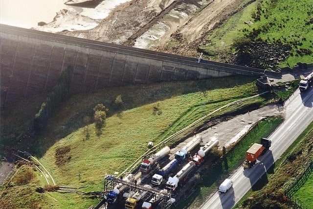 A fleet of water tankers taking water directly from the reservoir during a drought in 1995.