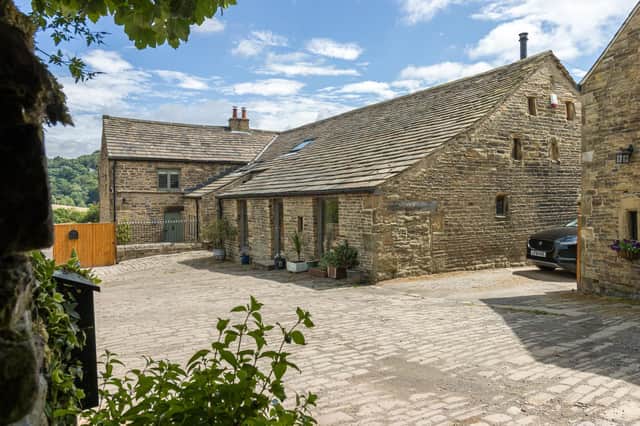 This impressive property comes with stables, a studio, a workshop, and 12 acres of land.