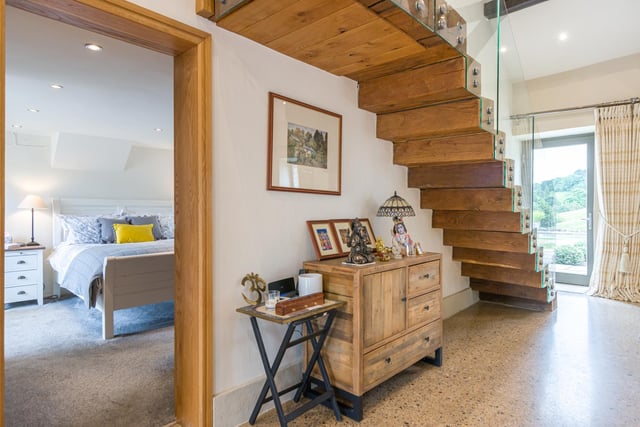 The wooden staircase, views to the rear, and a doorway to one of the double bedrooms.