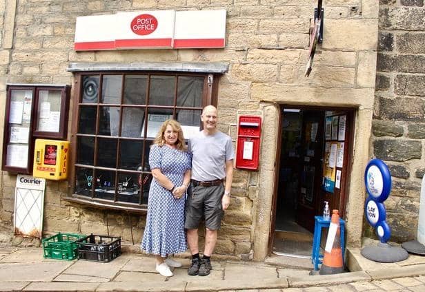 Tony and his wife Heather outside Heptonstall Post Office.