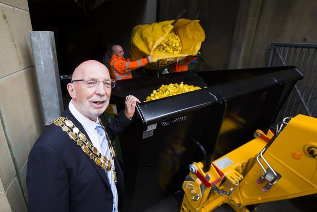 Mayor of Hebden Royd Town Coun Rob Freeth with the digger being loaded up with the ducks.