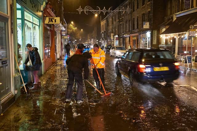 Businesses in Market Street, Hebden Bridge fight back the flood water