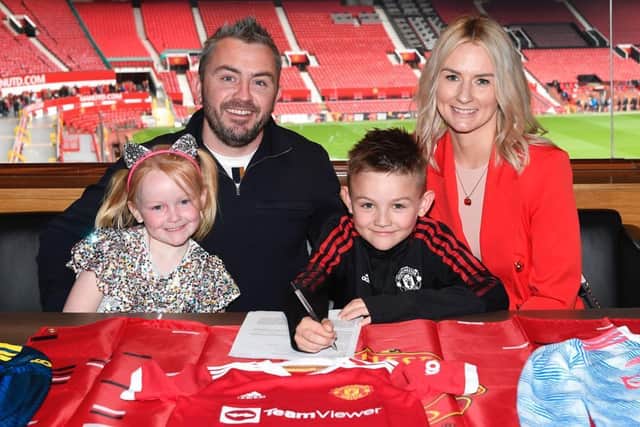 Jack at Old Trafford with his mum, dad and sister
