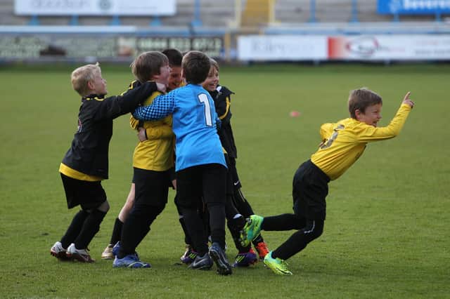 Northowram Colts U9s celebrate a penalty shoot-out win over Clifton A in the Junior Euro Cup tournament at The Shay.
