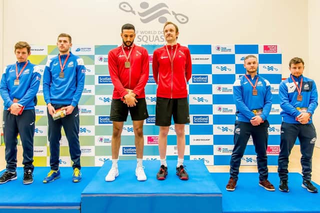 England's Declan James and James Willstrop on top of the podium at the World Doubles.