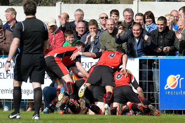 Town players celebrate a goal in the semi-final second-leg win at Guiseley in 2013