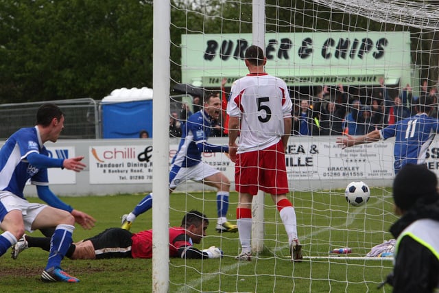 Lee Gregory wheels away in celebration (right) having just scored the winning goal in 2013's final at Brackley